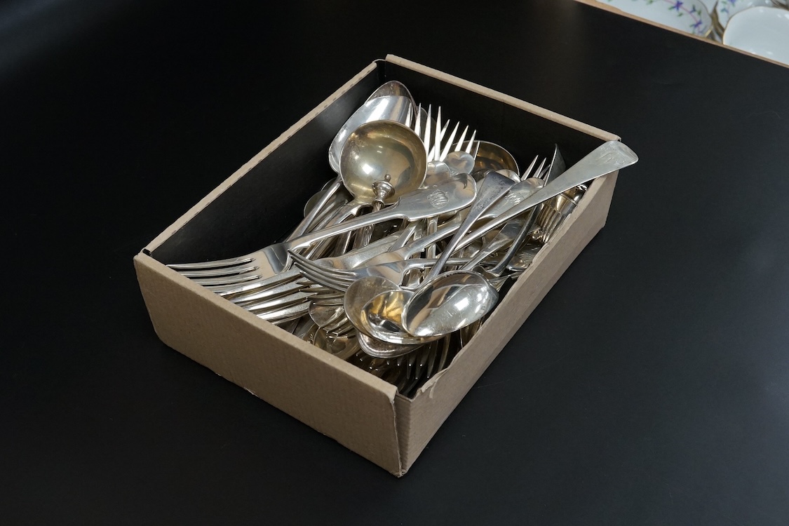 A quantity of assorted mainly 19th century flatware, various patterns, dates and makers including a set of six George III fiddle pattern table spoons by Eley, Fearn & Chawner, London, 1809, six silver fiddle pattern tabl